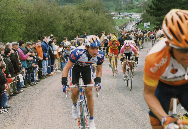 Italy's Olympic champion Paolo Bettini, left, looks at his