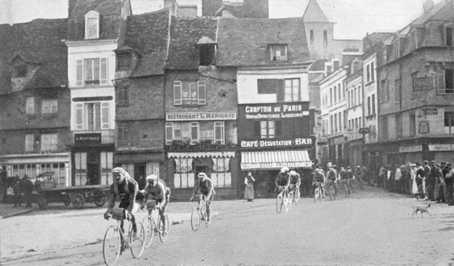 Faber leads the pack through Pont Audemer in the 1914 Tour de France